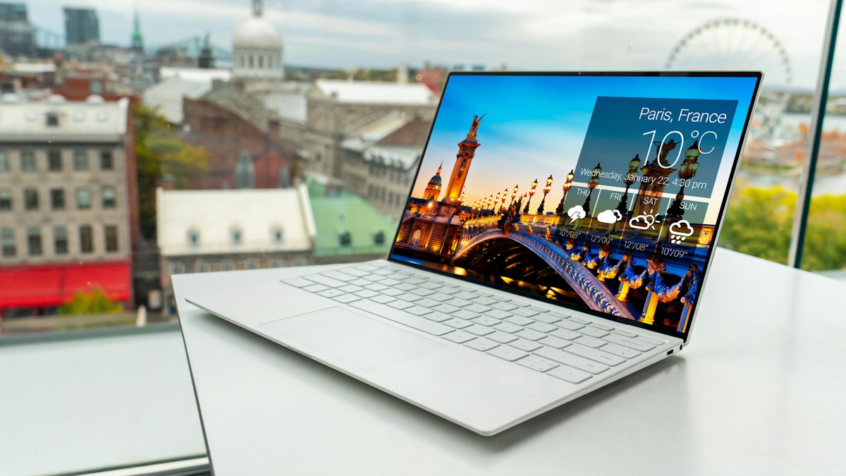 Laptop on a desk showing a travel booking website