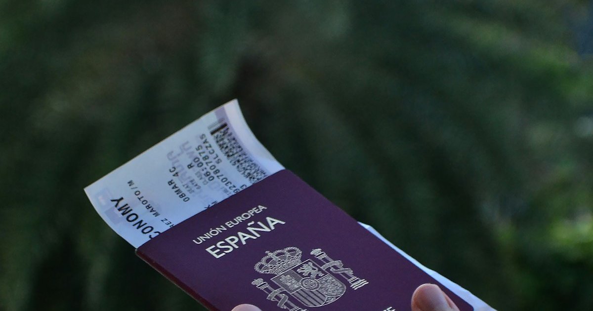 Passport and boarding pass held before travel, the documents customers expect when ATOL protection applies to a flight-inclusive booking