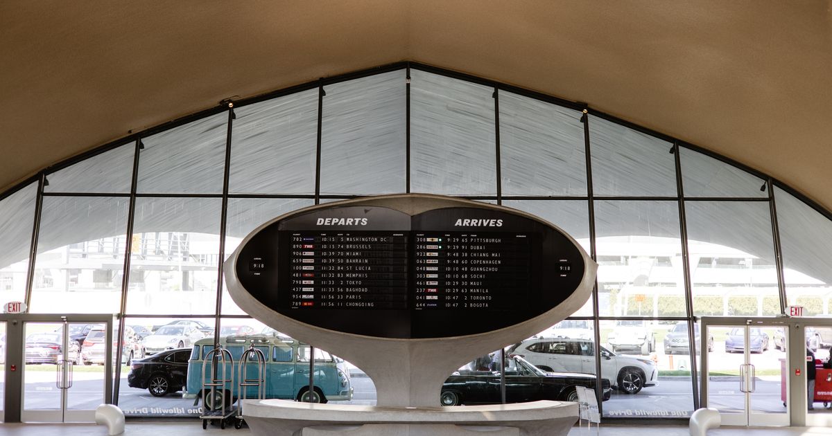Airport departures and arrivals board listing flights to cities worldwide, the kind of flight options meta search sites compare for travel agencies